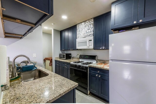 509 Darlene Ln Unit A, Glendale Heights, IL 60139 - kitchen with white appliances, blue cabinetry, light stone countertops, and recessed lighting