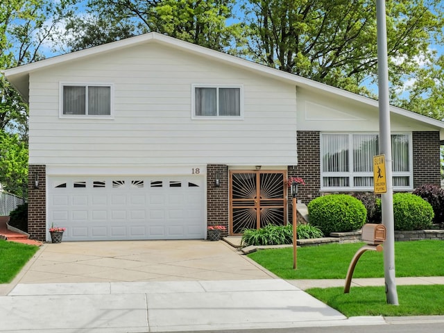 18 E 155th Pl, South Holland, IL 60473 - split level home with brick siding, an attached garage, driveway, and a front lawn