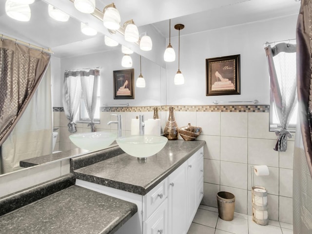 18 E 155th Pl, South Holland, IL 60473 - bathroom with tile walls, healthy amount of natural light, vanity, tile patterned floors, and a wainscoted wall