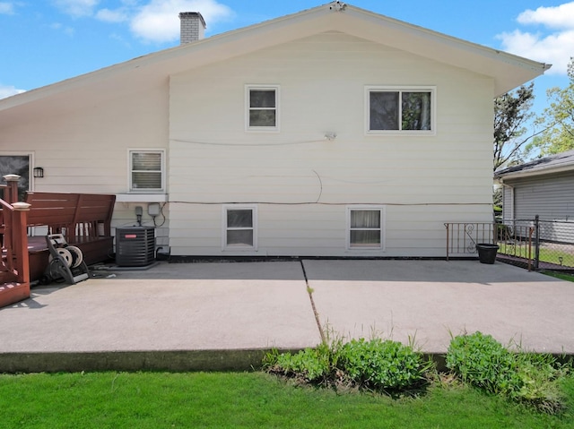 18 E 155th Pl, South Holland, IL 60473 - rear view of property featuring a patio and a chimney