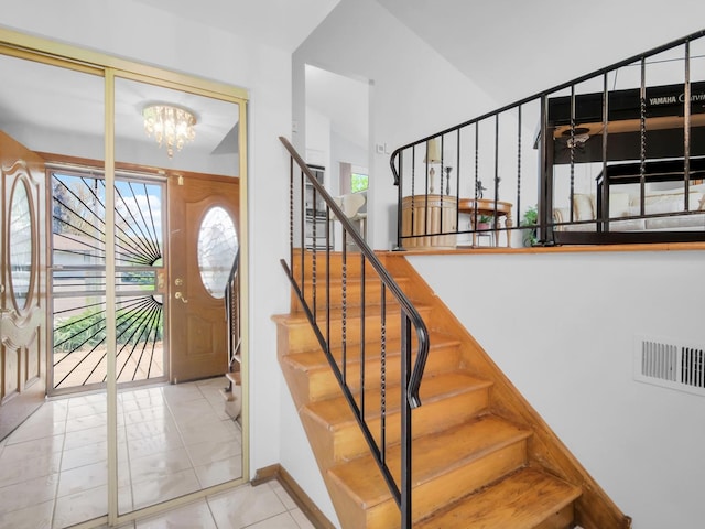 18 E 155th Pl, South Holland, IL 60473 - entrance foyer featuring a chandelier, stairway, and tile patterned floors
