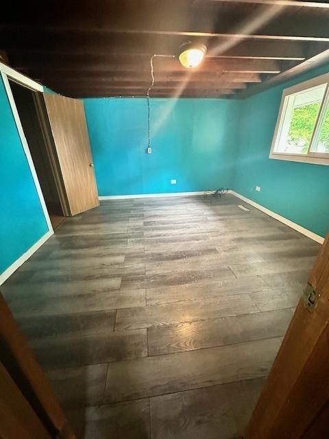 110 N Frolic Ave, Waukegan, IL 60085 - below grade area with wood finished floors and baseboards