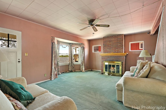 36 S Pistakee Lake Rd, Fox Lake, IL 60020 - living room with a fireplace, carpet, ceiling fan, and ornamental molding