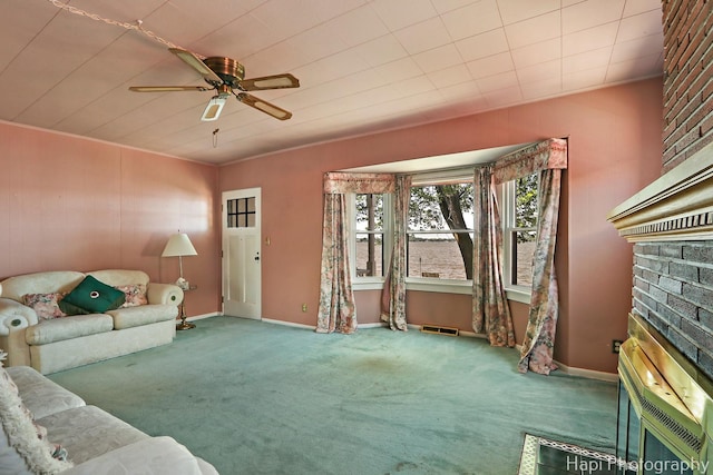 36 S Pistakee Lake Rd, Fox Lake, IL 60020 - unfurnished living room with carpet floors, a fireplace, and ceiling fan