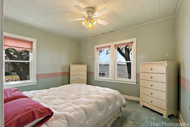36 S Pistakee Lake Rd, Fox Lake, IL 60020 - bedroom featuring multiple windows, carpet floors, ornamental molding, and ceiling fan