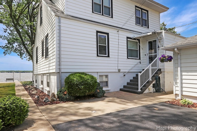 36 S Pistakee Lake Rd, Fox Lake, IL 60020 - rear view of house featuring a water view