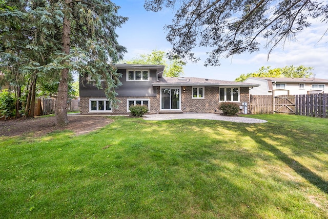 13741 S 85th Ave, Orland Park, IL 60462 - back of house with a patio, a fenced backyard, and brick siding