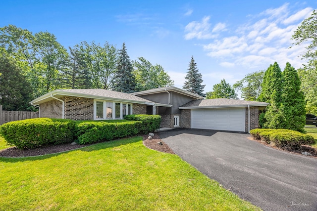 13741 S 85th Ave, Orland Park, IL 60462 - split level home with brick siding, a garage, and driveway