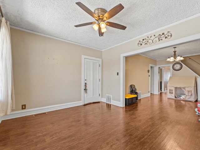 2529 Scoville Ave, Berwyn, IL 60402 - unfurnished living room featuring a textured ceiling, wood finished floors, a ceiling fan, a chandelier, and ornamental molding