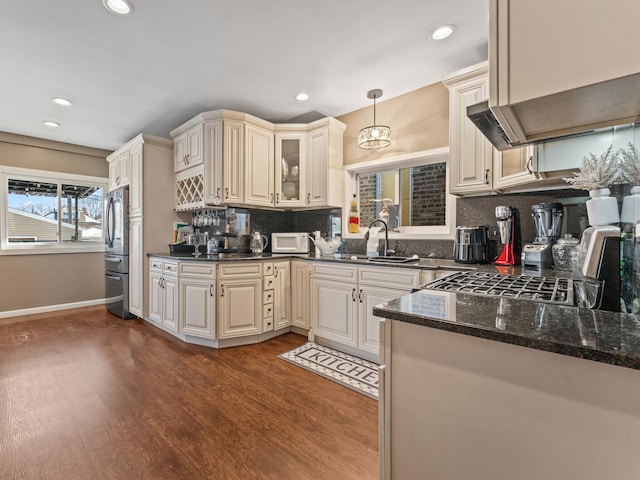 2529 Scoville Ave, Berwyn, IL 60402 - kitchen featuring white microwave, gas range, dark wood finished floors, tasteful backsplash, and recessed lighting