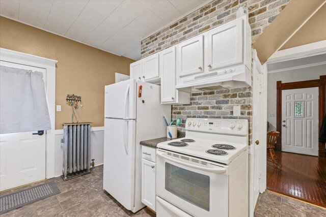 543 E Orleans St, Paxton, IL 60957 - kitchen featuring white appliances, radiator, under cabinet range hood, and white cabinets