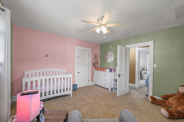 543 E Orleans St, Paxton, IL 60957 - carpeted bedroom featuring a ceiling fan and a crib