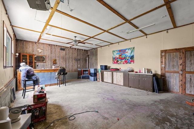543 E Orleans St, Paxton, IL 60957 - miscellaneous room with concrete floors, wooden walls, and a workshop area