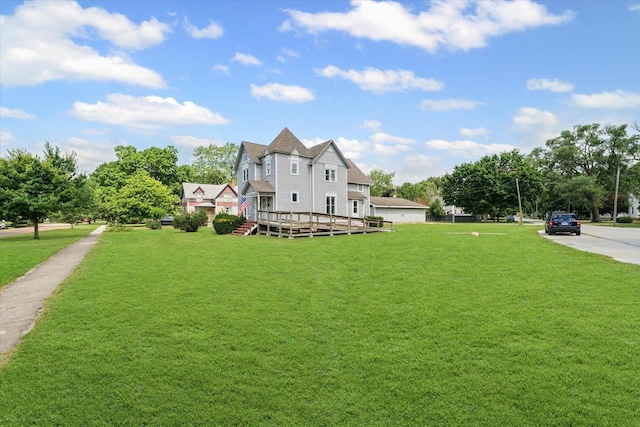 543 E Orleans St, Paxton, IL 60957 - view of front of property featuring a wooden deck and a front lawn