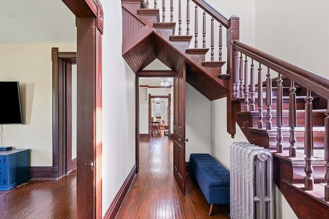 543 E Orleans St, Paxton, IL 60957 - stairs featuring radiator heating unit and wood-type flooring
