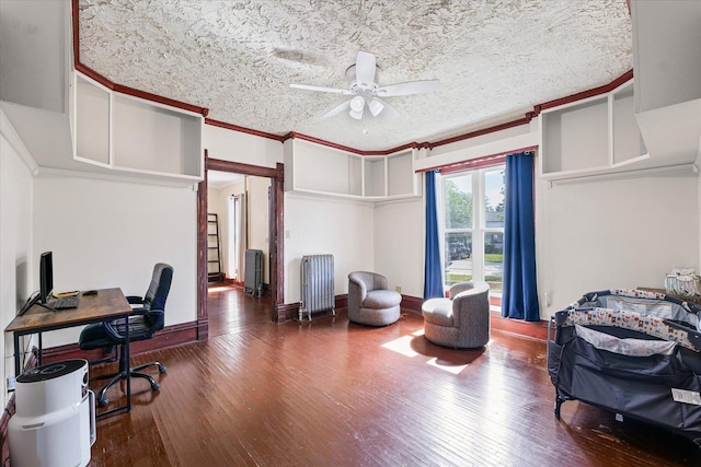 543 E Orleans St, Paxton, IL 60957 - office with hardwood / wood-style floors, ceiling fan, radiator heating unit, ornamental molding, and a textured ceiling