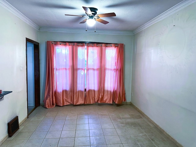 5608 S Spaulding Ave, Chicago, IL 60629 - spare room with a ceiling fan, crown molding, and light tile patterned floors