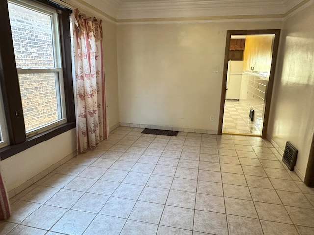 5608 S Spaulding Ave, Chicago, IL 60629 - spare room with crown molding and light tile patterned flooring