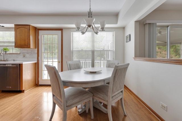 514 Abbeywood Dr, Cary, IL 60013 - dining room featuring light wood-style floors, healthy amount of natural light, and a chandelier