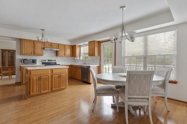 514 Abbeywood Dr, Cary, IL 60013 - kitchen with a chandelier, stainless steel appliances, and light countertops