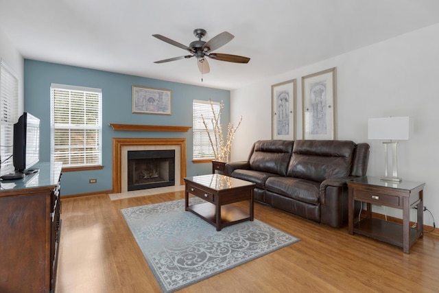 514 Abbeywood Dr, Cary, IL 60013 - living area with ceiling fan, wood finished floors, and a fireplace