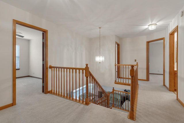 514 Abbeywood Dr, Cary, IL 60013 - corridor with an upstairs landing, carpet, and a chandelier
