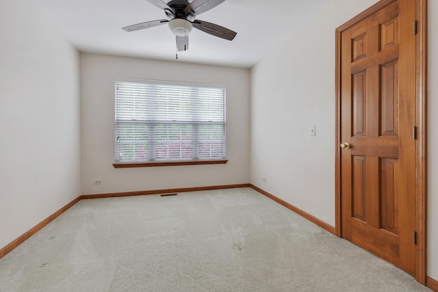 514 Abbeywood Dr, Cary, IL 60013 - empty room featuring light carpet and a ceiling fan