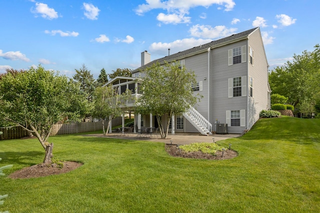 514 Abbeywood Dr, Cary, IL 60013 - rear view of property featuring a patio, a sunroom, a chimney, stairs, and a deck