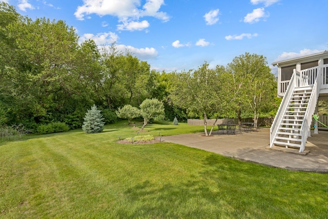 514 Abbeywood Dr, Cary, IL 60013 - view of grassy yard with stairway, a patio, and a sunroom
