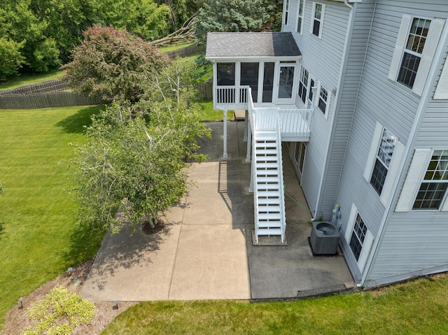 514 Abbeywood Dr, Cary, IL 60013 - view of property exterior with a sunroom, stairs, and a patio area