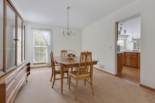 514 Abbeywood Dr, Cary, IL 60013 - dining space with a chandelier and light carpet