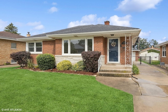 1627 Downing Ave, Westchester, IL 60154 - view of front facade with a gate, a chimney, brick siding, and stone siding