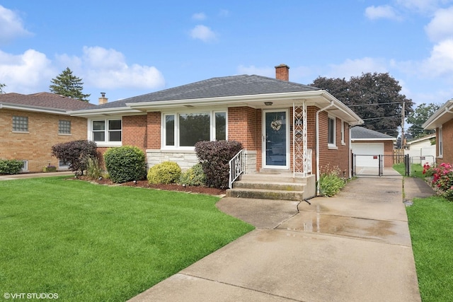 1627 Downing Ave, Westchester, IL 60154 - view of front of property with a chimney, a gate, brick siding, a garage, and an outdoor structure