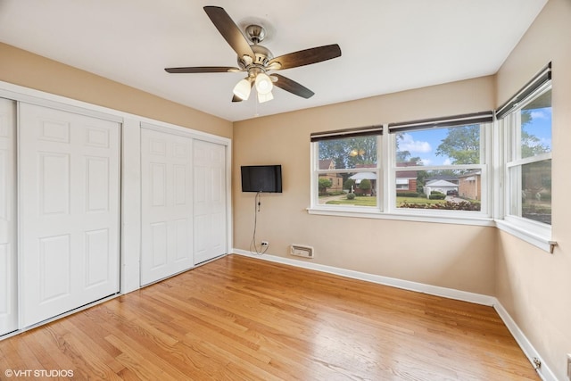 1627 Downing Ave, Westchester, IL 60154 - unfurnished bedroom with light wood-style flooring and a ceiling fan