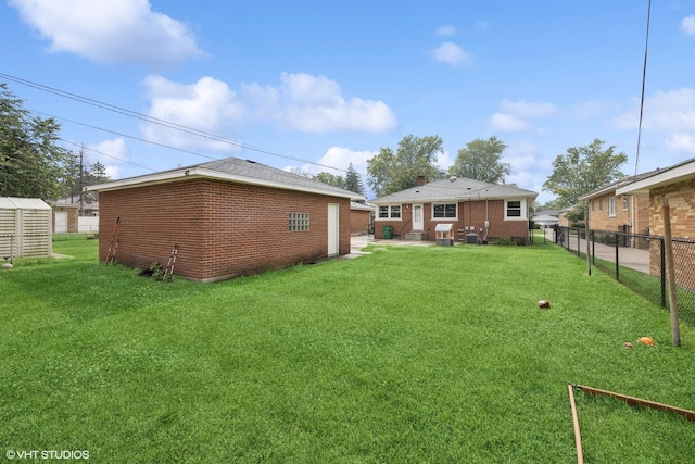 1627 Downing Ave, Westchester, IL 60154 - rear view of property with brick siding, an outbuilding, and a patio
