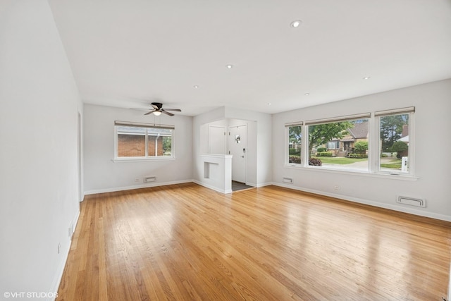 1627 Downing Ave, Westchester, IL 60154 - unfurnished living room featuring light wood finished floors, ceiling fan, and recessed lighting