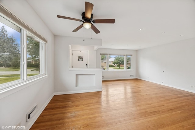 1627 Downing Ave, Westchester, IL 60154 - unfurnished living room with light wood-style flooring, a ceiling fan, and recessed lighting
