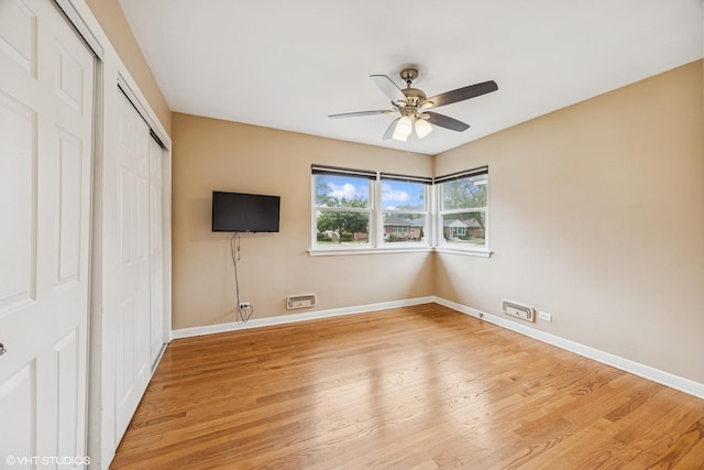 1627 Downing Ave, Westchester, IL 60154 - unfurnished bedroom featuring a closet, light wood finished floors, and ceiling fan