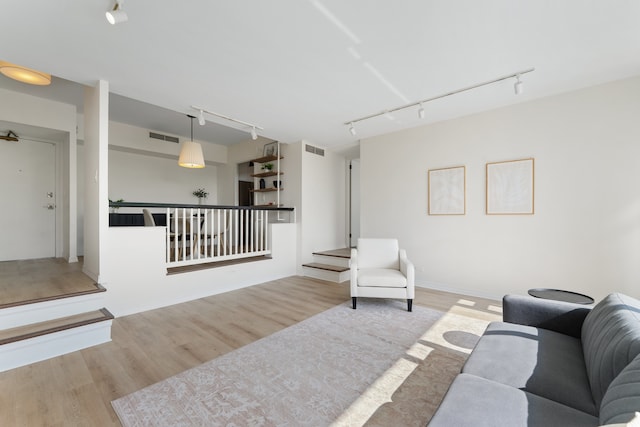 3200 N Lake Shore Dr Unit 302, Chicago, IL 60657 - living room featuring rail lighting and wood finished floors