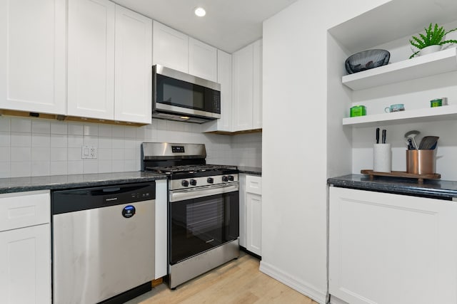 3200 N Lake Shore Dr Unit 302, Chicago, IL 60657 - kitchen with appliances with stainless steel finishes, light wood-style flooring, white cabinetry, open shelves, and recessed lighting