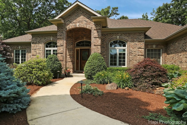 9516 Thousand Oaks Dr, Spring Grove, IL 60081 - view of front of property with brick siding and a shingled roof