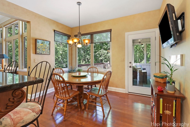 9516 Thousand Oaks Dr, Spring Grove, IL 60081 - dining room featuring dark wood-style floors and a chandelier
