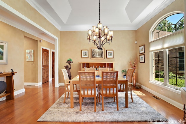 9516 Thousand Oaks Dr, Spring Grove, IL 60081 - dining space with a chandelier, wood finished floors, and crown molding