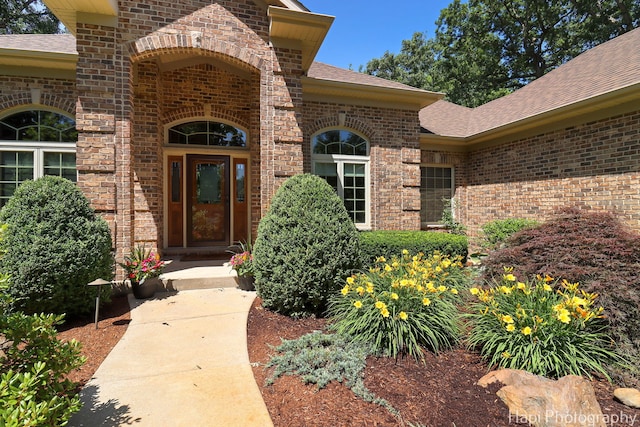 9516 Thousand Oaks Dr, Spring Grove, IL 60081 - doorway to property with brick siding and roof with shingles