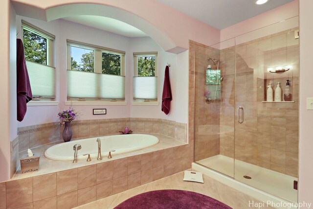 9516 Thousand Oaks Dr, Spring Grove, IL 60081 - full bath featuring a bath, a shower stall, and tile patterned floors