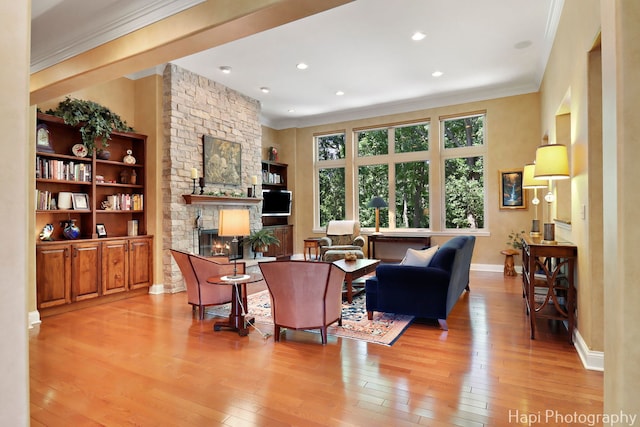 9516 Thousand Oaks Dr, Spring Grove, IL 60081 - living area featuring ornamental molding, light wood-style floors, recessed lighting, and a stone fireplace