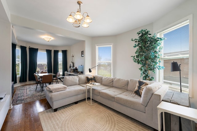 1630 N Avers Ave, Chicago, IL 60647 - living area with wood finished floors, healthy amount of natural light, and a chandelier