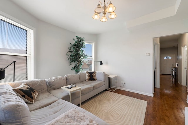 1630 N Avers Ave, Chicago, IL 60647 - living room with dark wood-type flooring and a chandelier