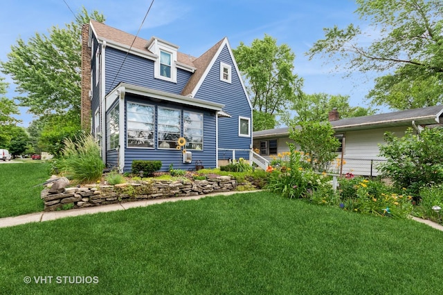 1429 N May St, Joliet, IL 60435 - view of front facade featuring a front lawn