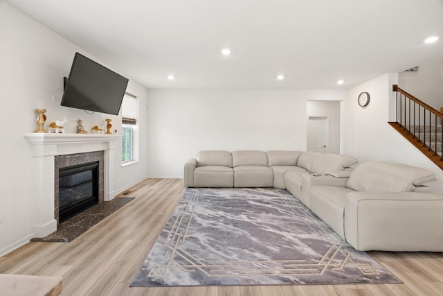 153 N Bend Way, Elgin, IL 60124 - living room with stairway, wood finished floors, recessed lighting, and a high end fireplace